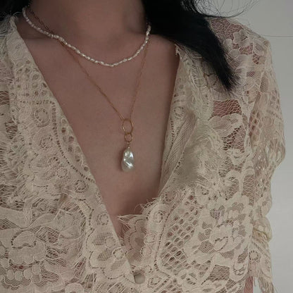 ‘Moonlight and Planetary Rings’ Warm White Baroque Pendant