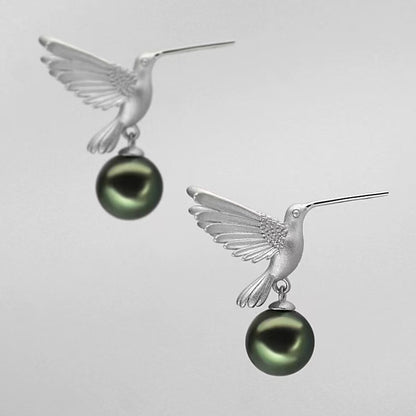 “A mist on the sea where the hummingbirds fly” Handmade gold and silver carved hummingbird pearl earrings