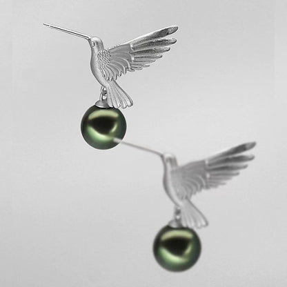 “A mist on the sea where the hummingbirds fly” Handmade gold and silver carved hummingbird pearl earrings