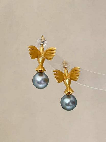 “A mist on the sea where the hummingbirds fly” Handmade gold and silver carved hummingbird pearl earrings