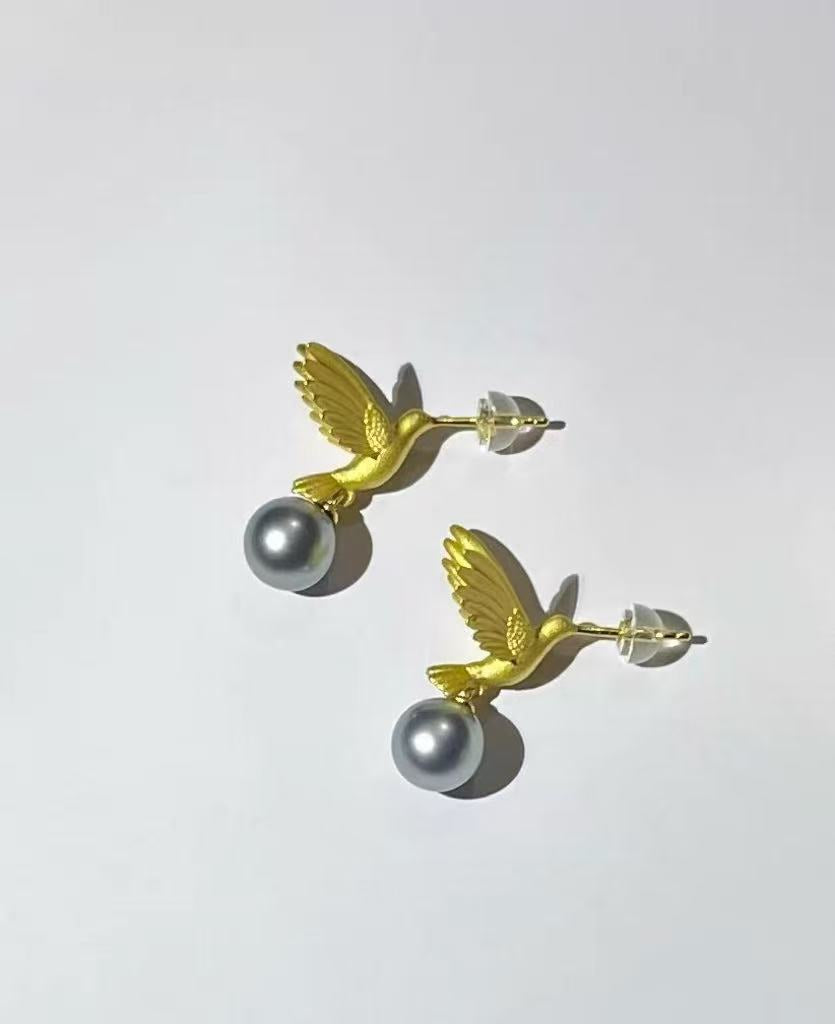 “A mist on the sea where the hummingbirds fly” Handmade gold and silver carved hummingbird pearl earrings
