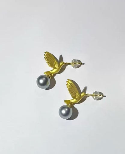 “A mist on the sea where the hummingbirds fly” Handmade gold and silver carved hummingbird pearl earrings