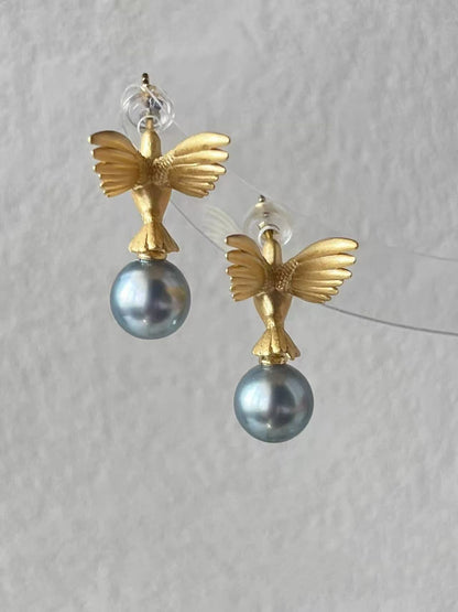 “A mist on the sea where the hummingbirds fly” Handmade gold and silver carved hummingbird pearl earrings