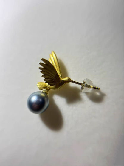 “A mist on the sea where the hummingbirds fly” Handmade gold and silver carved hummingbird pearl earrings