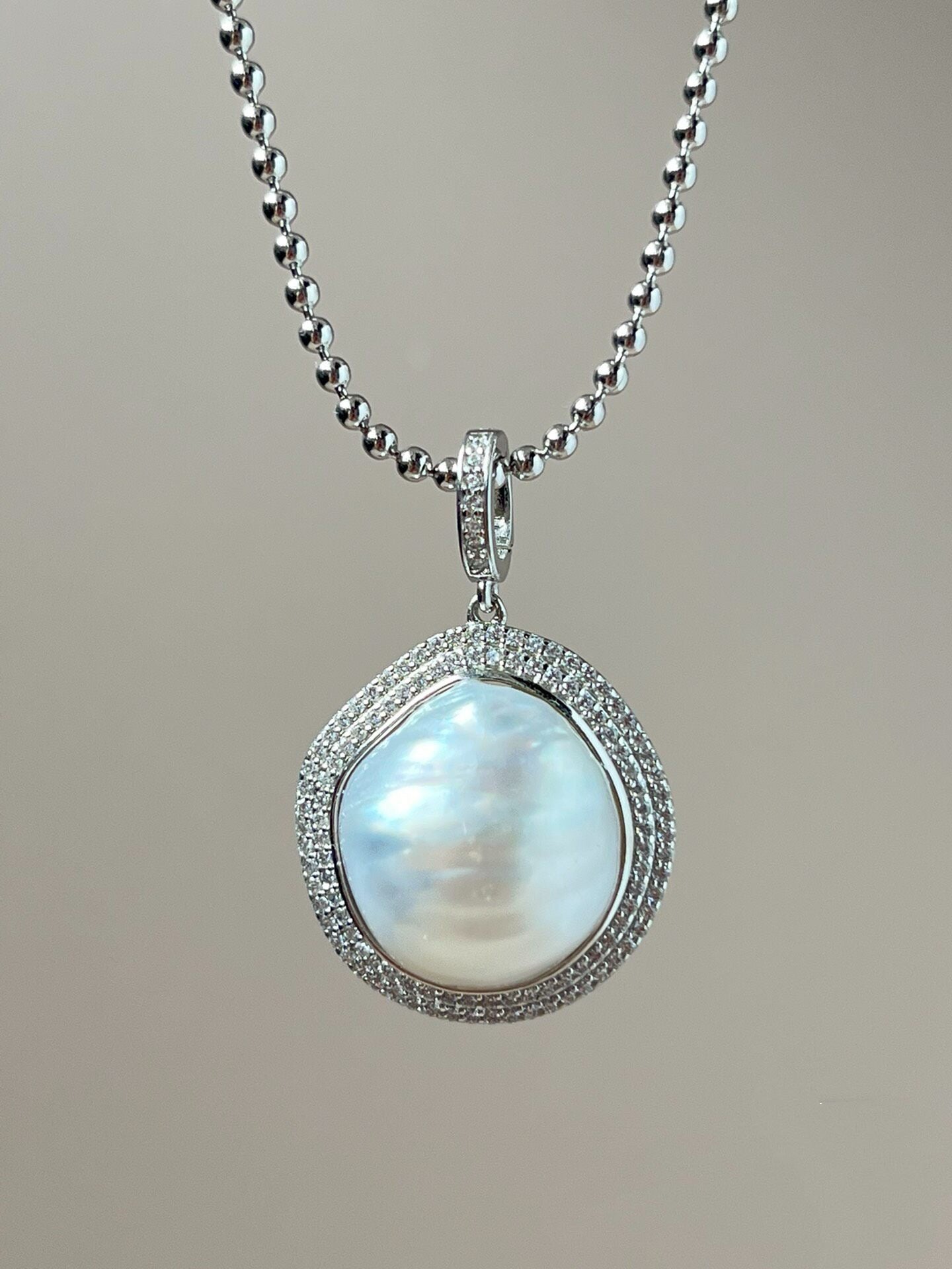 “Touch” Seawater Australian-White Baroque Pearl Featured Pendant Collection Solar Iris